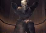 A statue of Atlas from the first God of War, depicted with his trademark robe, beard, and two arms.
